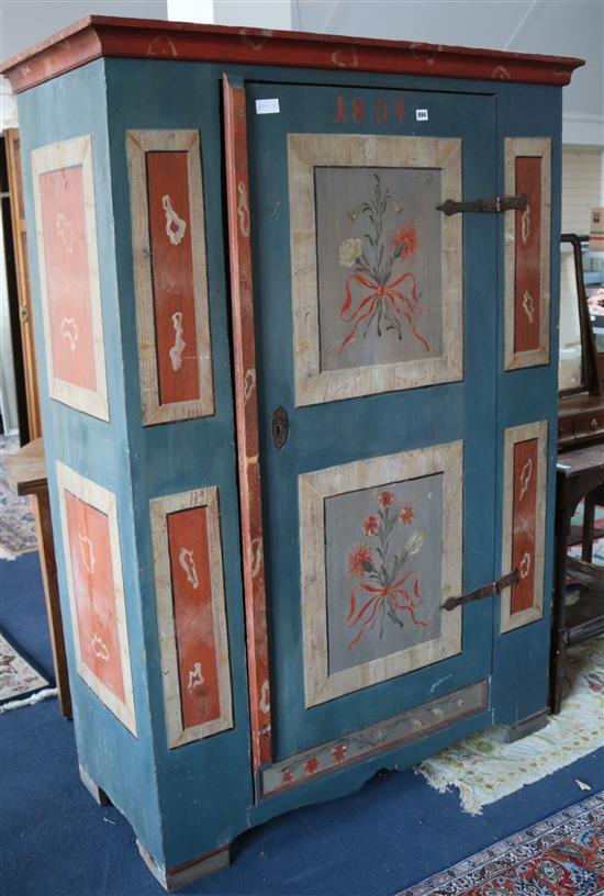 A painted and decorated cupboard 123cm. H.174cm.